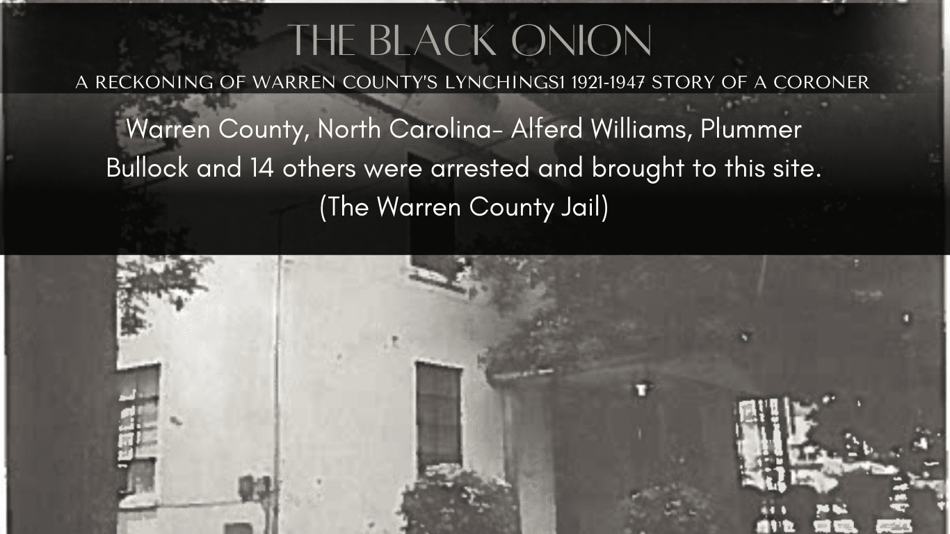 A black and white photo of the front yard of an old house.